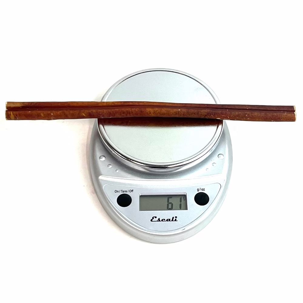 12" Bully Sticks | Thick (53-70g) | Low-Medium Odor 3 12" straight bully sticks, thick, low-medium odor, on a scale