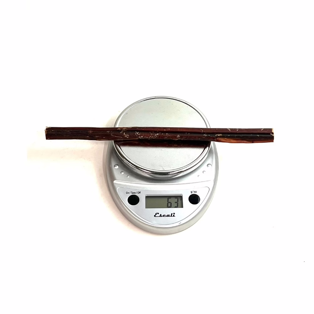 12" Bully Sticks - Overcooked/Imperfect **Tend To Chew Through More Quickly** | Thick (50-74g) | Low Odor 3 12" straight bully sticks, thick, slightly overcooked, imperfect appearance, low odor, on a scale